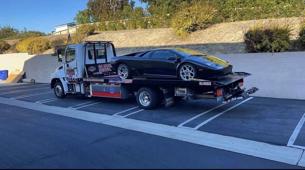Classic Lamborghini Diablo on a flatbed tow truck